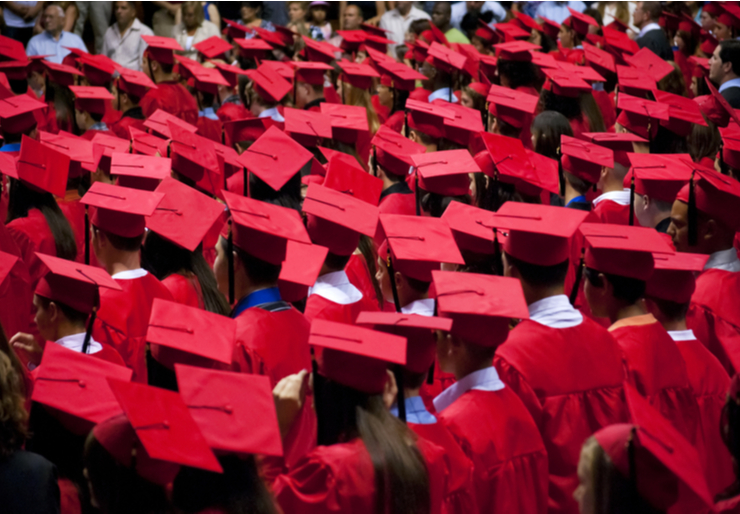 a sea of red graduation caps