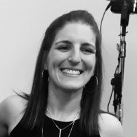 Black and white picture of a brunette woman smiling